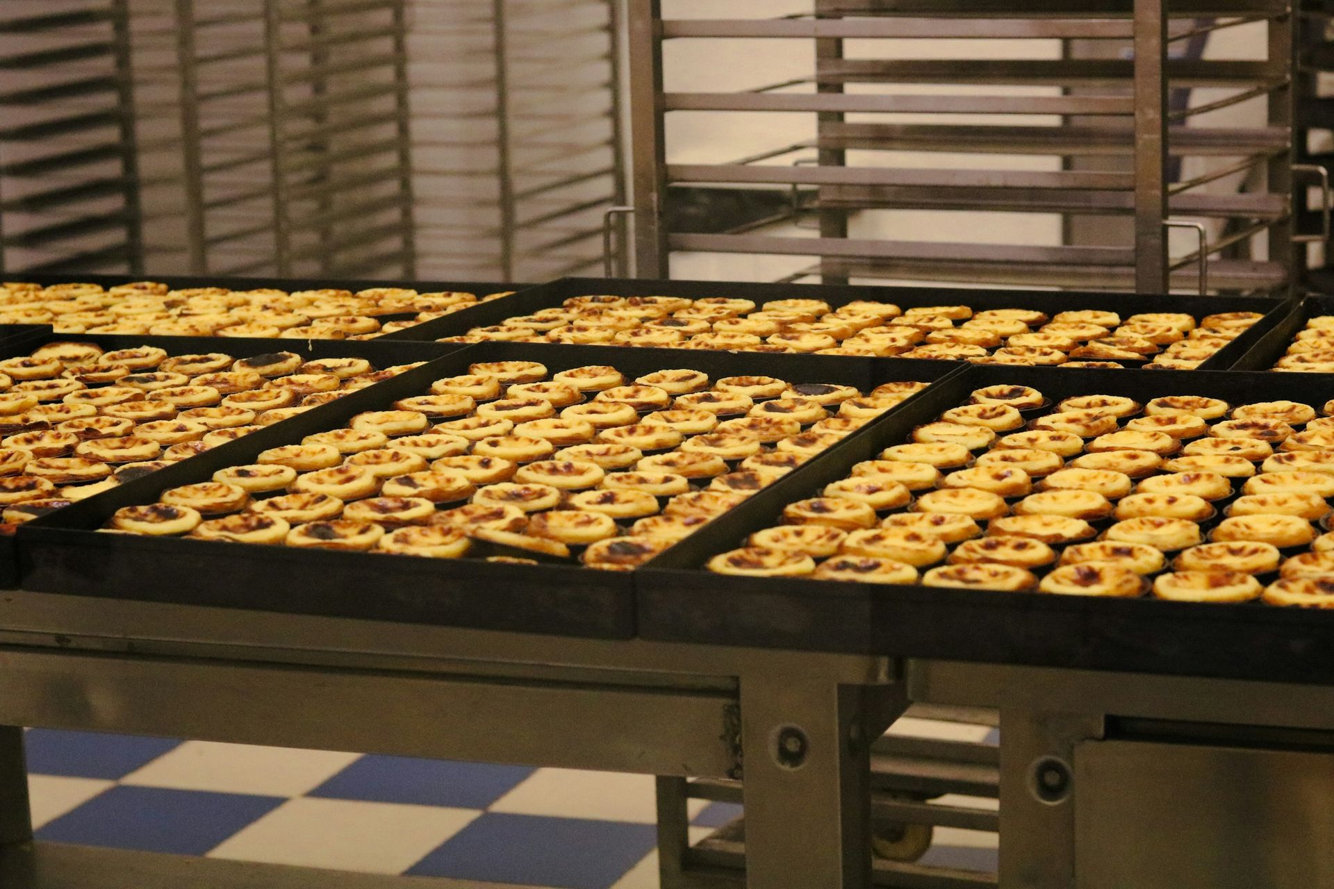 Pastries on baking trays in a production bakery